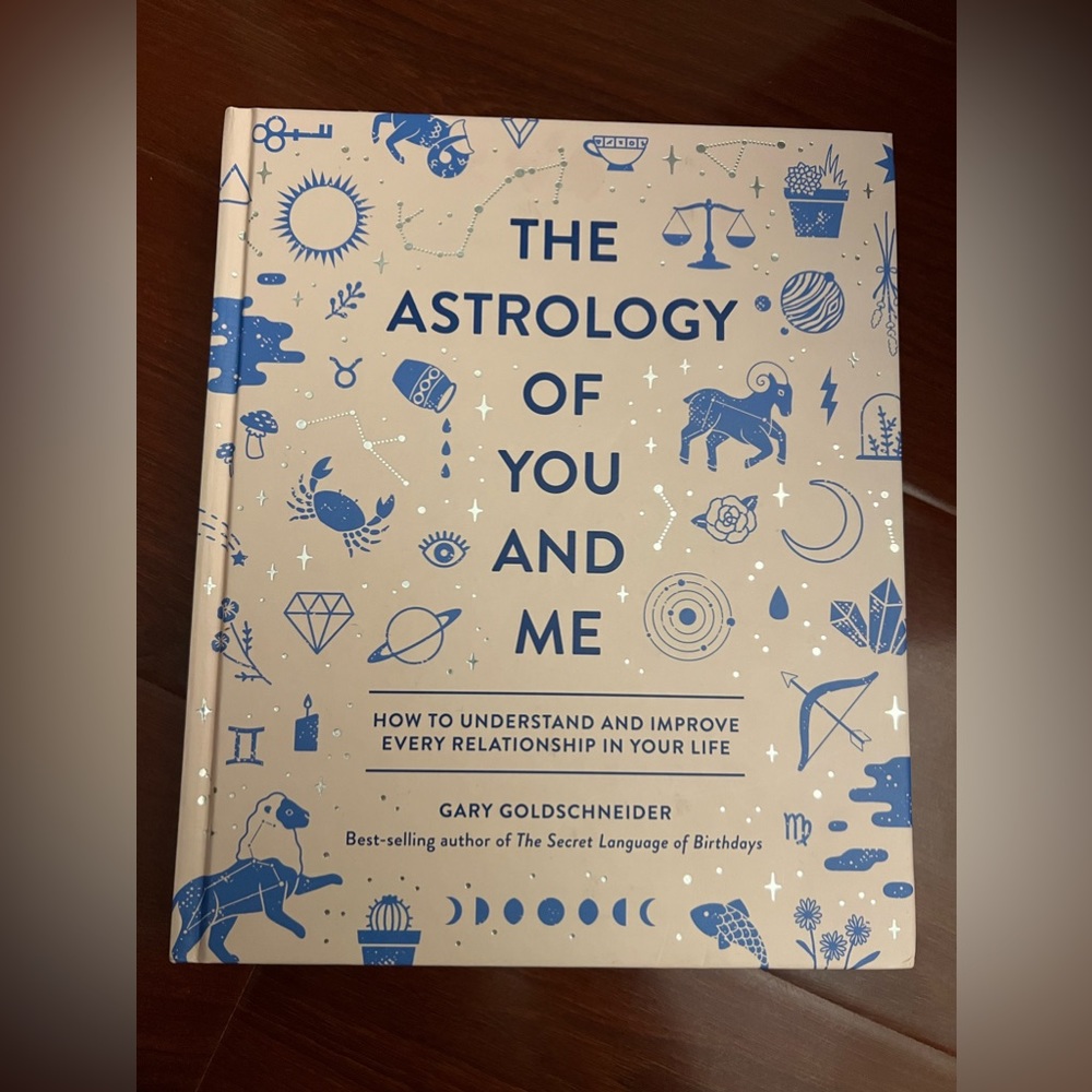 Astrology of You and Me Hardcover Book